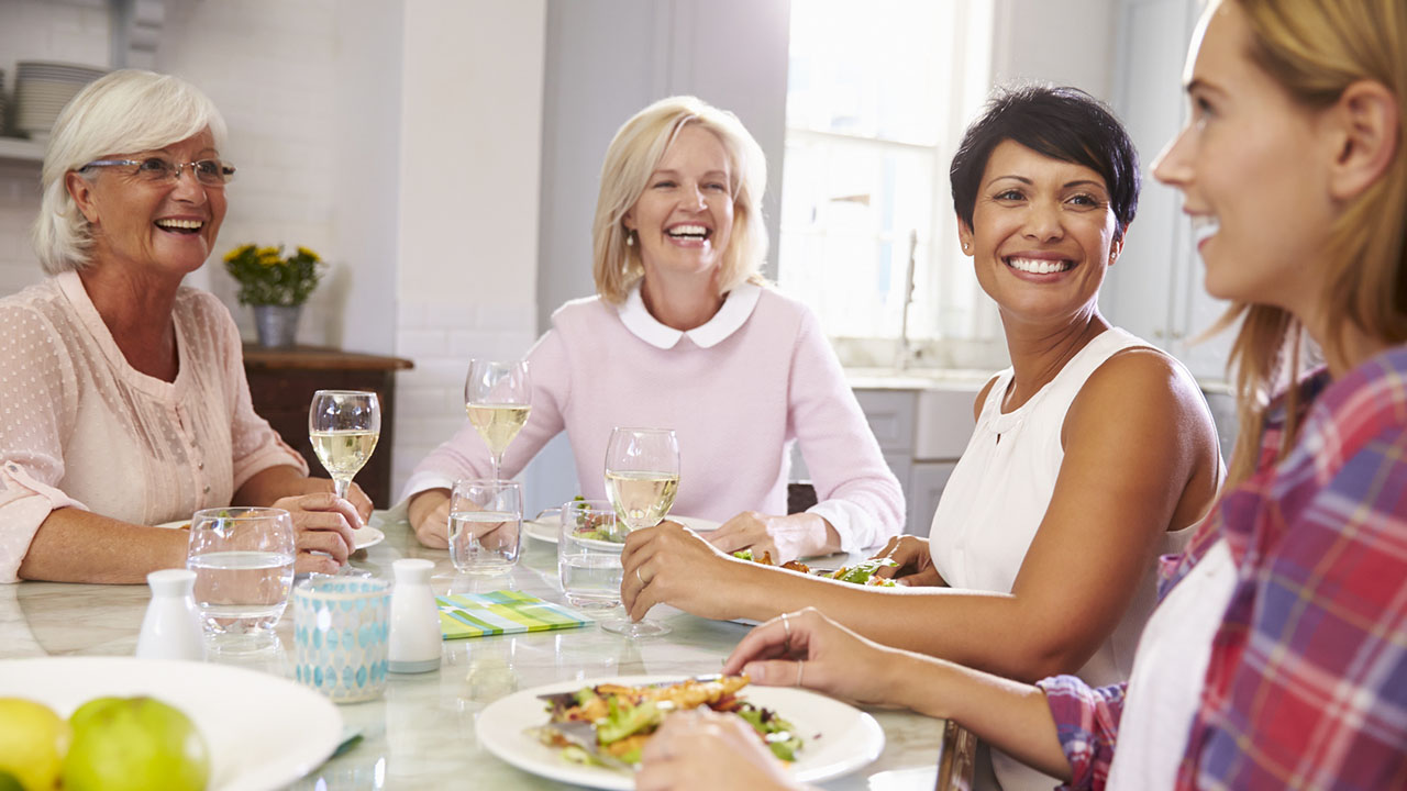 Group of women enjoying dinner together