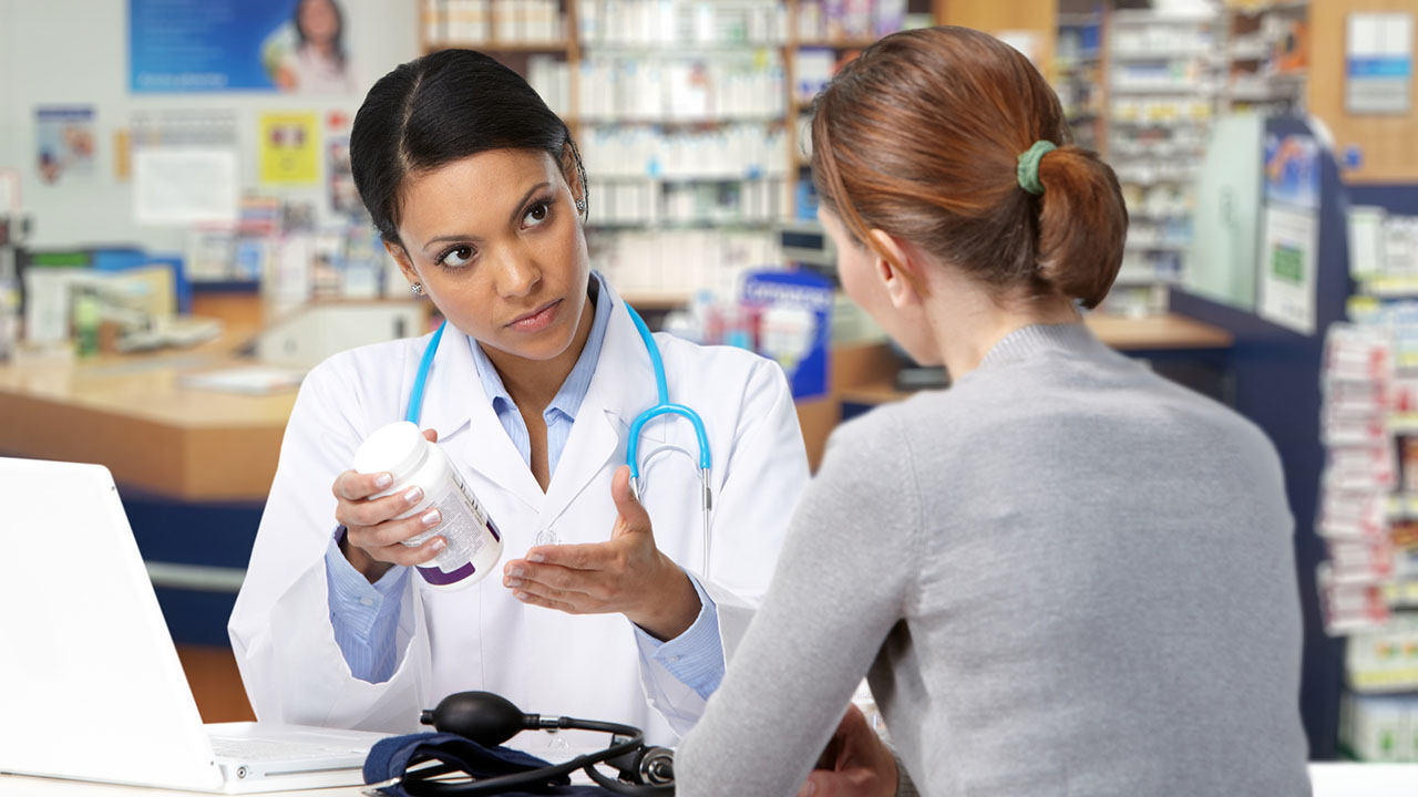 Doctor discusses medication with patient
